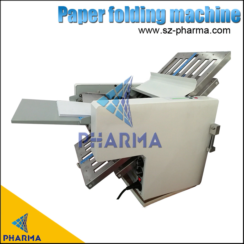 Manual paper folding machines for pharmaceutical use